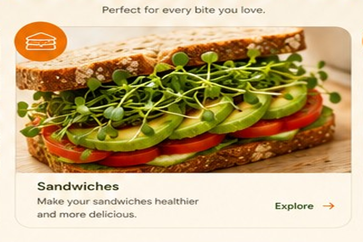 Sandwich filled with avocado, tomato and microgreens